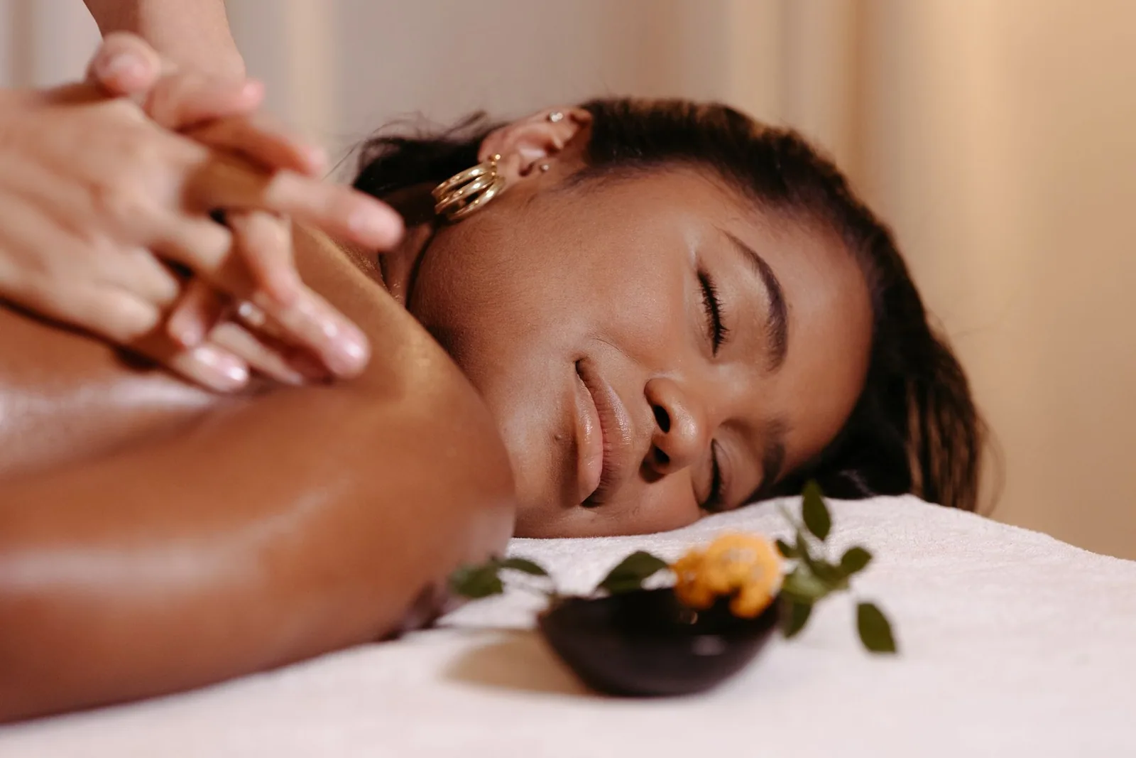 A client receiving a calm shoulder massage