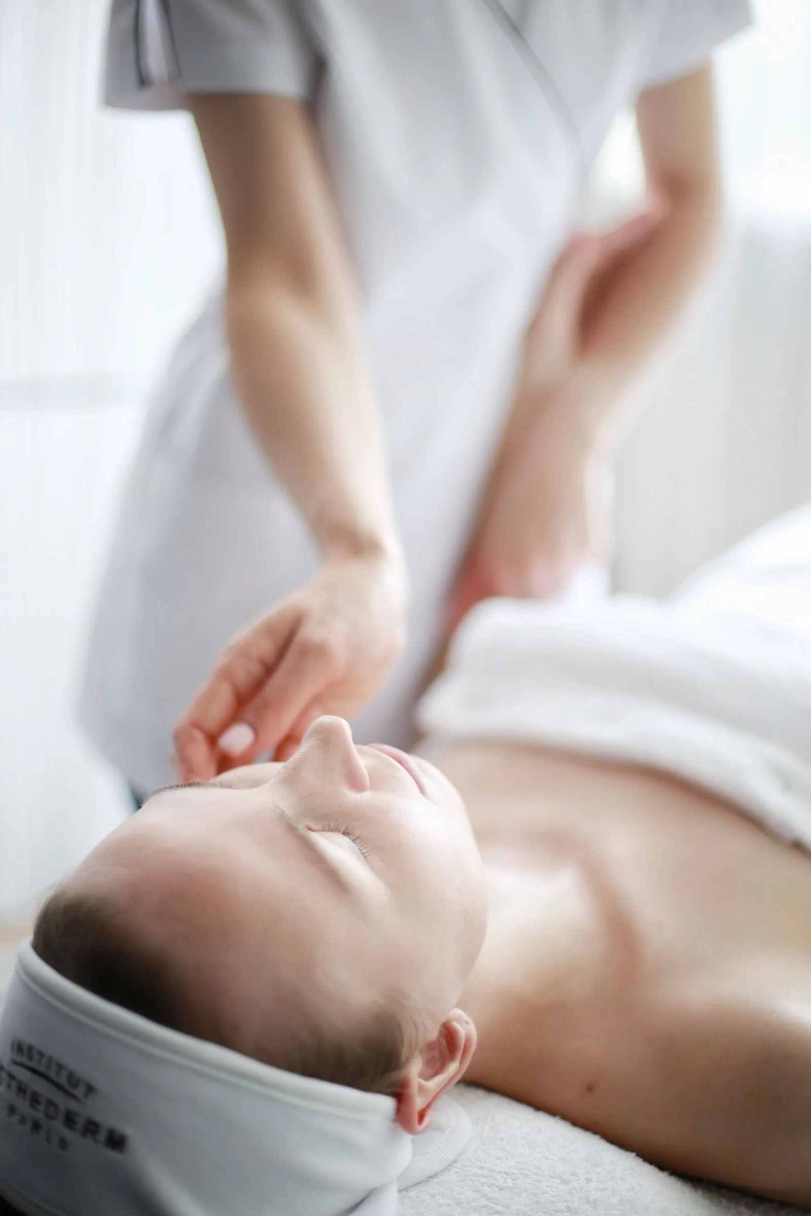 Gentle touch during a light, fully clothed treatment